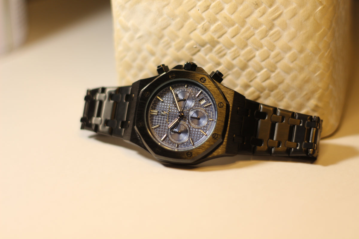 Bartlett 1954 Serov Pro II chronograph, black case and bracelet with a blue dial, angled view