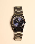 Bartlett 1954 Arvel, silver steel case and bracelet with a blue sunburst dial and day-date, front view