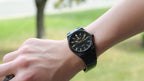 Bartlett 1954 Orin in all black with gold hands, worn on the wrist