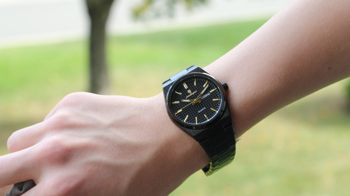 Bartlett 1954 Orin in all black with gold hands, worn on the wrist