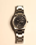 Bartlett 1954 Orin, silver steel case and bracelet with a black textured dial, front view