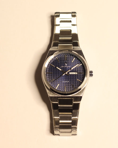 Bartlett 1954 Orin, silver steel case and bracelet with a blue textured dial, front view