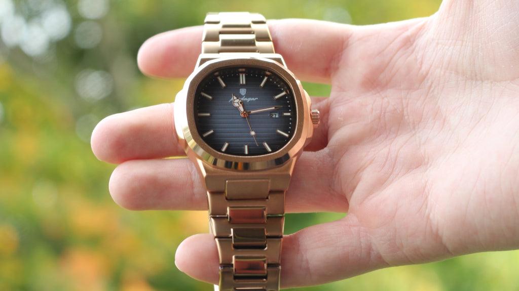 Bartlett 1954 Rivant in rose gold held in hand outdoors, showing the grey gradient dial