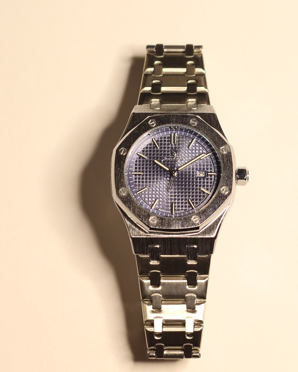Bartlett 1954 Serov, silver octagonal case with a blue textured dial, front view