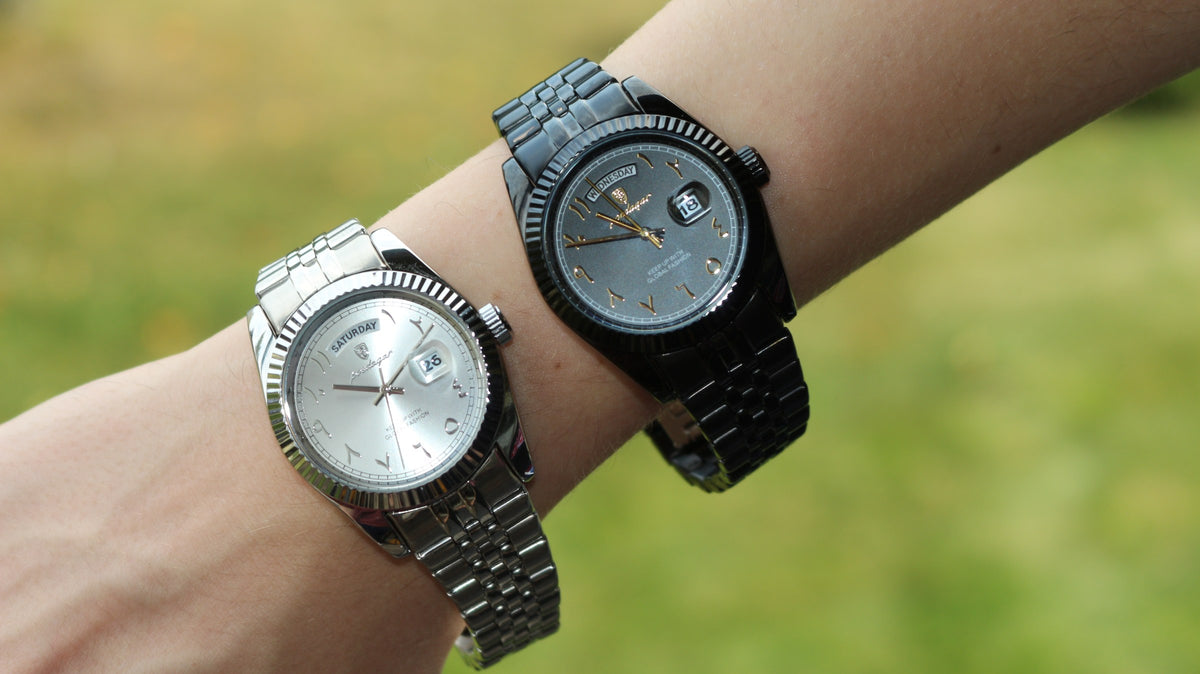 The Emperor in black and in silver worn together on the wrist