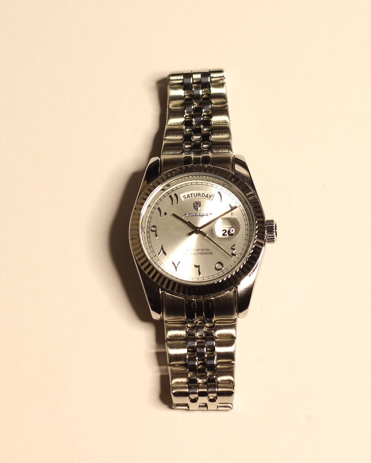 Bartlett 1954 The Emperor, silver case and five-link bracelet with a silver dial, fluted bezel, Arabic numerals and day-date, front view